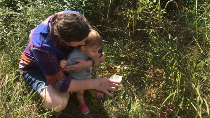 Elise & Violet Releasing a Butterfly at a Nature Center