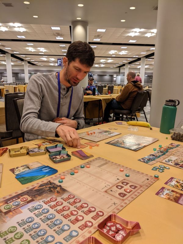 Jesse Playing a Game at the Fall Board Game Convention