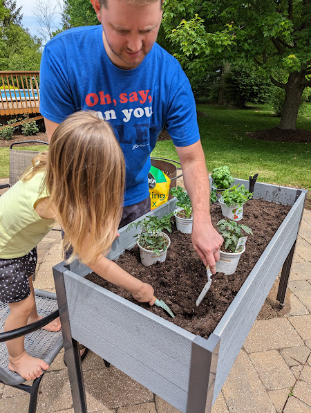 Getting Help from Ellie to Plant Our Garden